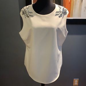 Elegant White Sleeveless Top with Silver Accents